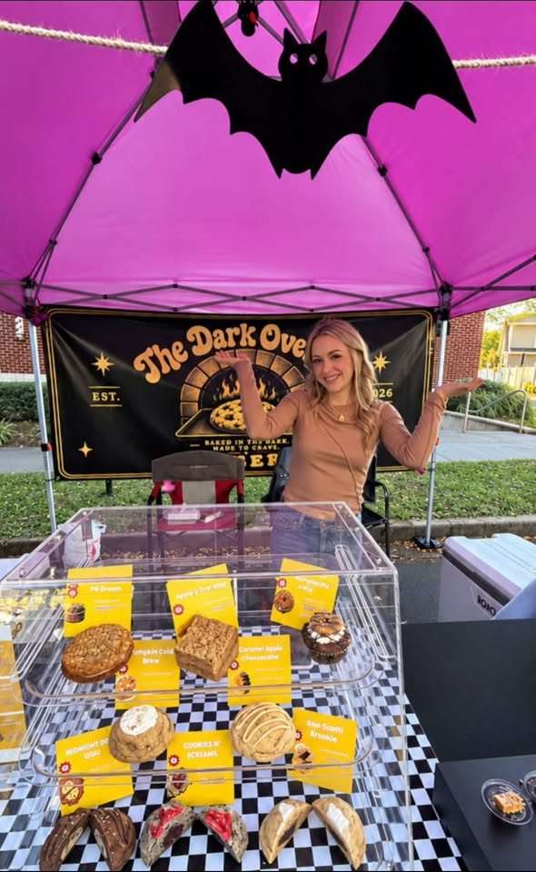 The Dark Oven Co. booth with its pink tent and display case